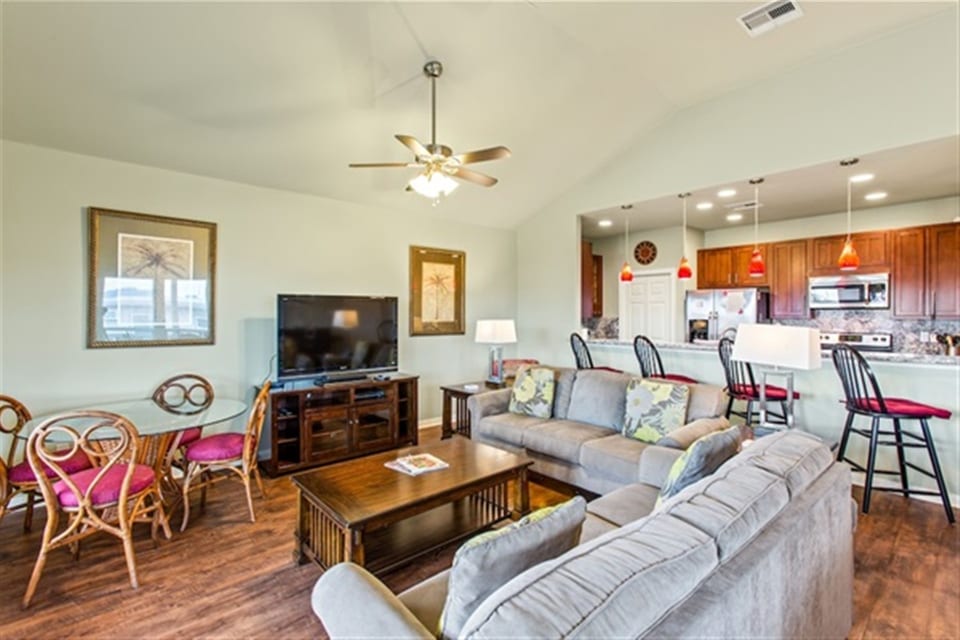 Whether you're settling in for a movie marathon, doing a puzzle on the glass table, or just enjoying easy conversation on the plush sofa, this is where family memories are made.