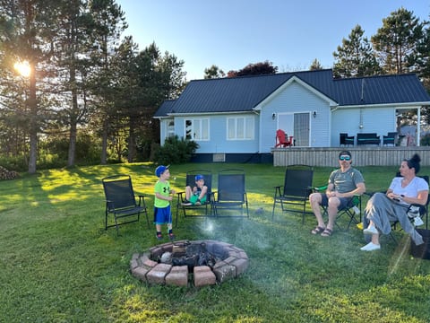 Exterior view w/firepit. New roof and siding in the last 2 years