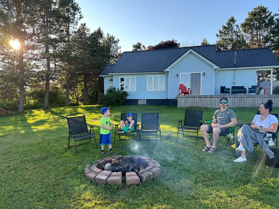 Exterior view w/firepit. New roof and siding in the last 2 years