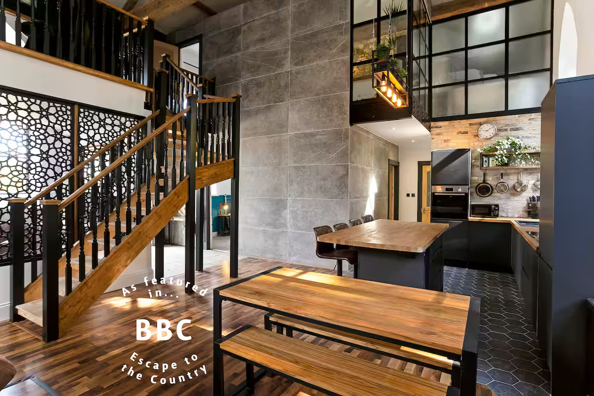 Main living area overlooked by mezzanine and main bedroom through 'Crittal style' interior windows...