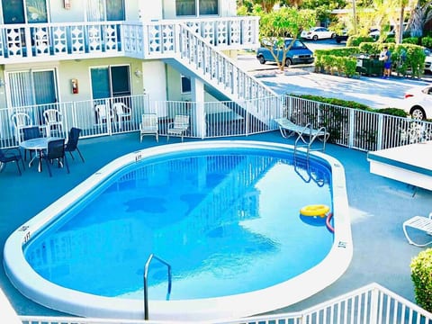 Heated pool with tables and chairs!