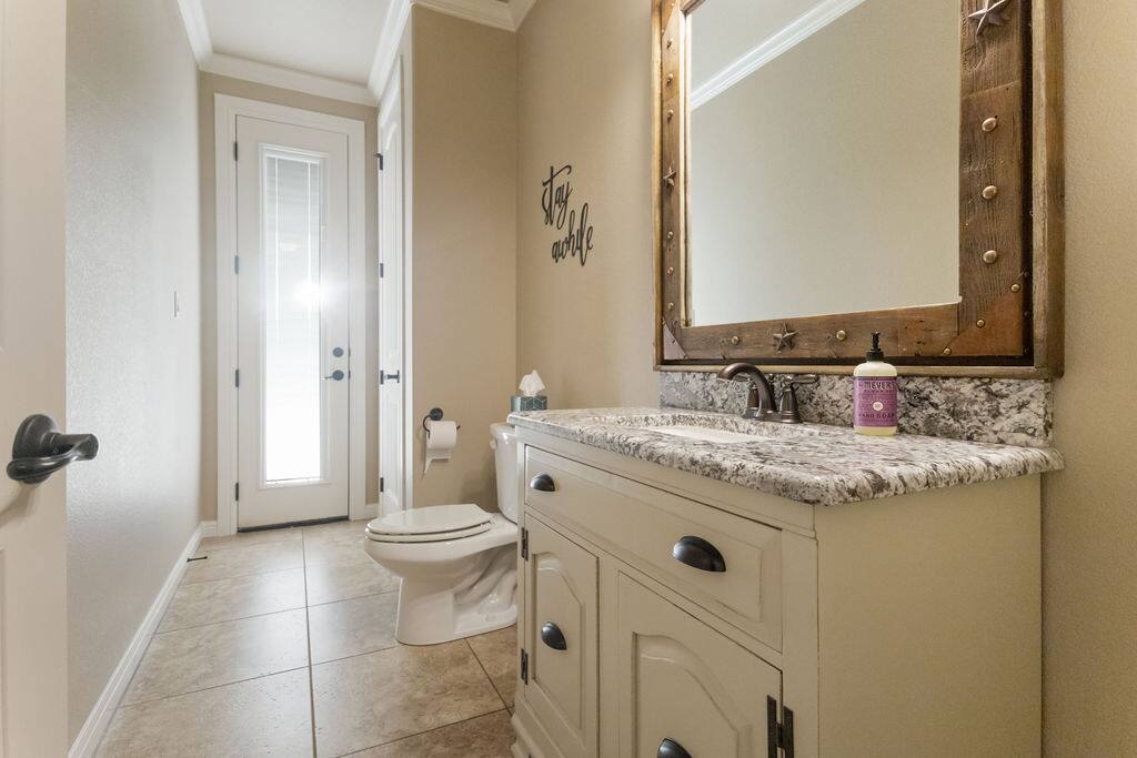 Pool bath with access to outside - Luxe Retreat: Pool, Hot Tub, Jacuzzi, EV Charger - Granbury
