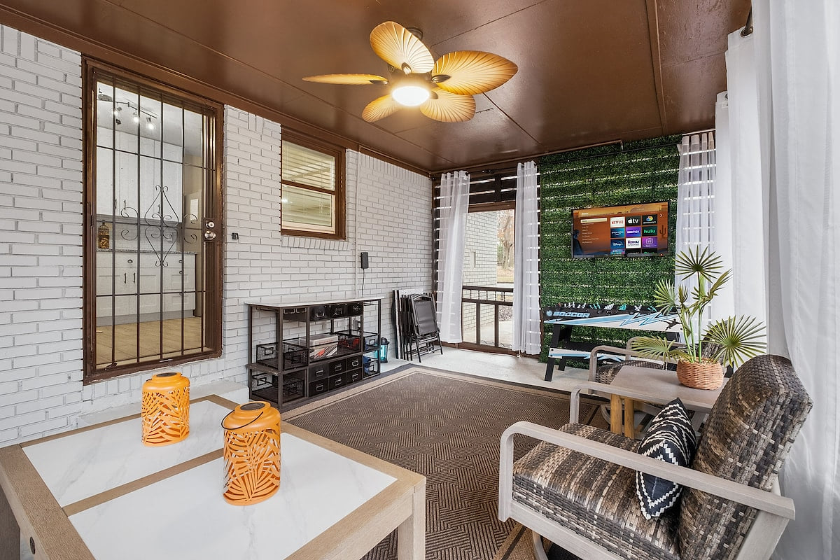 Screened-In & Chill Mode: Engaged 
Smart TV, plush seating, bar-height table, and ceiling fan, your cozy corner for lounging, streaming, or sipping something cold while the breeze rolls through.