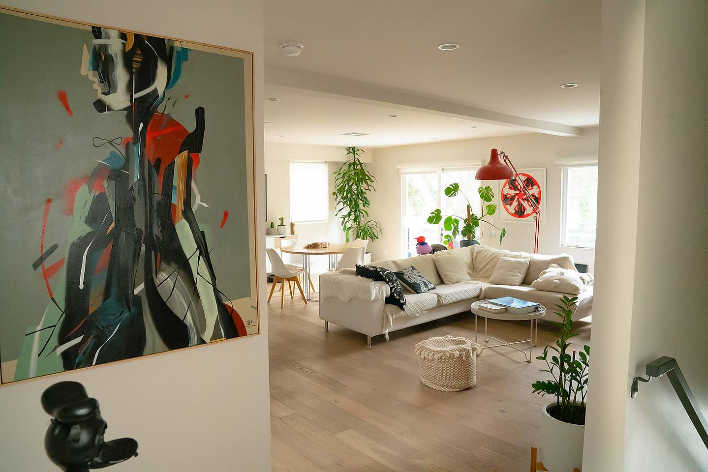Chic modern home flooded with light, cozy lounge, bold art, and stylish decor—perfect Airbnb stay for design lovers seeking comfort and great location.

