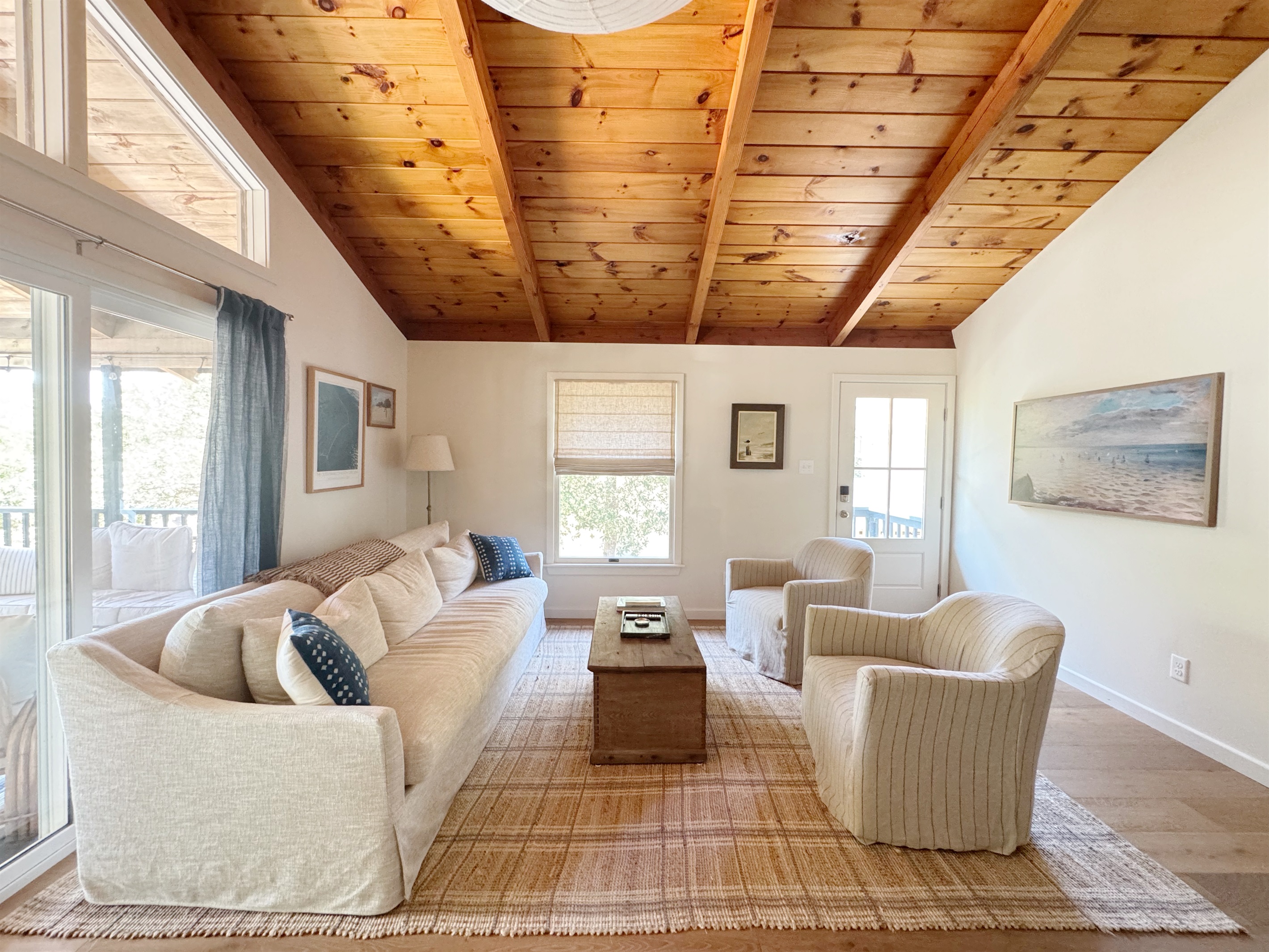 Spacious living room, open to the kitchen, with vaulted tongue and groove ceilings. 