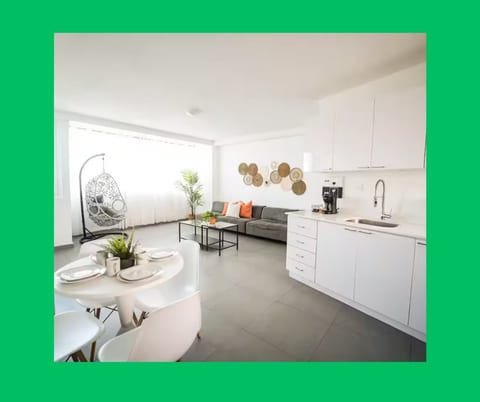 Great, open and spacious living room with Smart TV and large, comfy sofa.