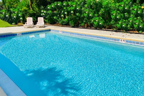 Community amenities include a Pool, grill pavilion, laundry, outdoor shower, free parking, & a fenced garden for frolicking!