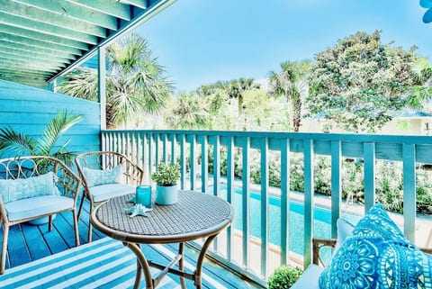 Private outdoor sanctuary overlooks the tranquil POOL & garden; a great spot for sunsets, games, & day dreaming!