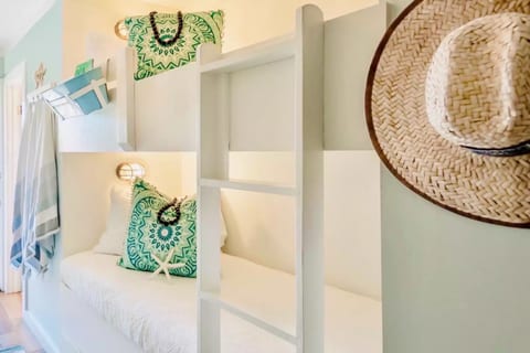 Your tranquil 4-bed coastal haven includes 2 cozy bunkbeds, tucked away in a hall for privacy