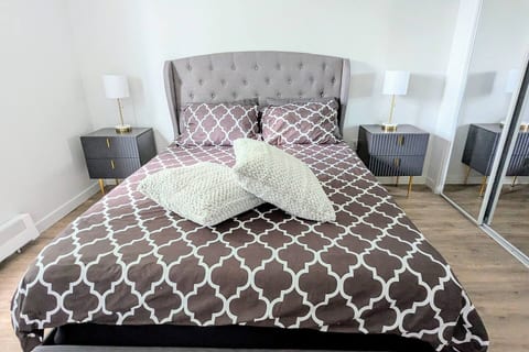 Cozy queen bed with stylish decor