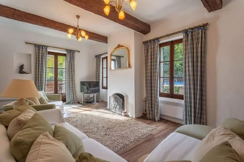 Lounge, with terrance and views over garden and pool.
