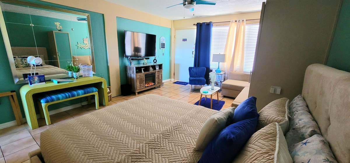 Desk area with Guest Welcome Binder & luggage rack Off Duty Mermaid Studio @ Daytona Beach