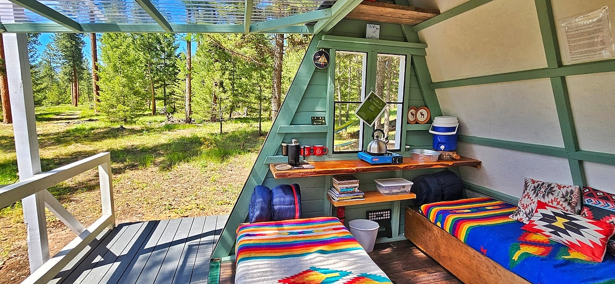 Coffee/tea making with a campstove in your cabin, or walk 1 minute to the Commons Area Lounge for a Full Kitchen setup.