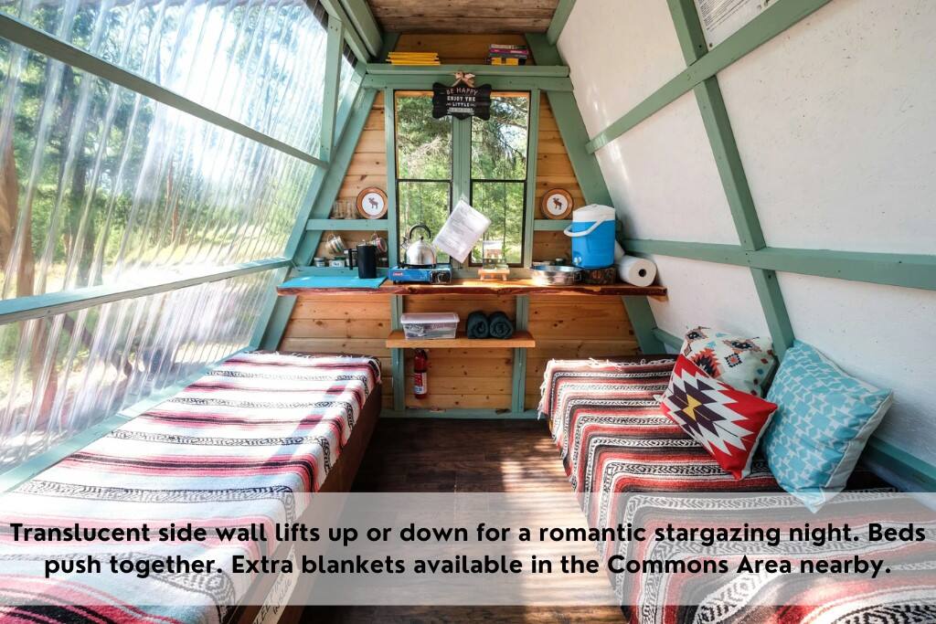 Translucent side wall lifts up or down for a romantic stargazing night.  Beds push together.  Extra blankets available in the Commons Area nearby. - Transforming, Pet-friendly A-frame Cabin + HotTub - Bonner-West Riverside