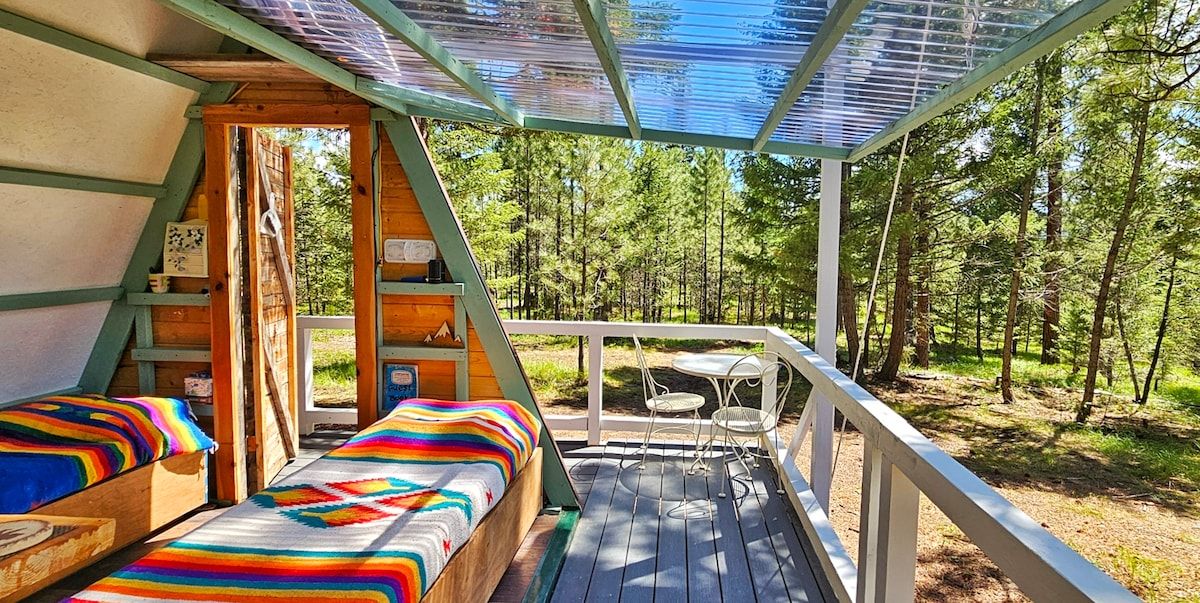 Keep the side wall closed or open for the ultimate indoor/outdoor experience at The A-frame Cabin near Missoula. 