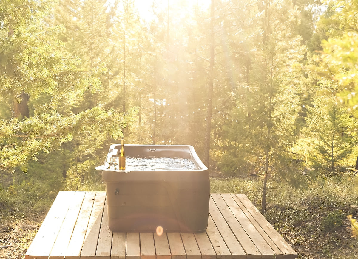 Shared, 2-seater hot tub is an ideal romantic destination nestled among the pines and under the stars.