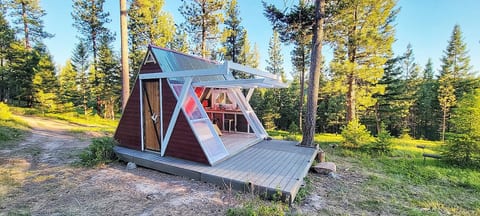 Bring your furry best friend and enjoy this A-frame cabin in the woods with a one of a kind translucent door-wall, which is operated with a push of a button. 