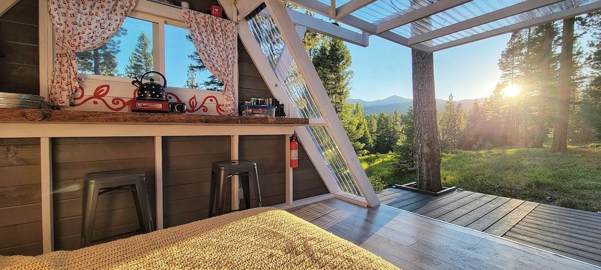 Keep the door wall open or closed with a push of a button. Enjoy the amazing mountain views in this cozy A-frame in the woods. 