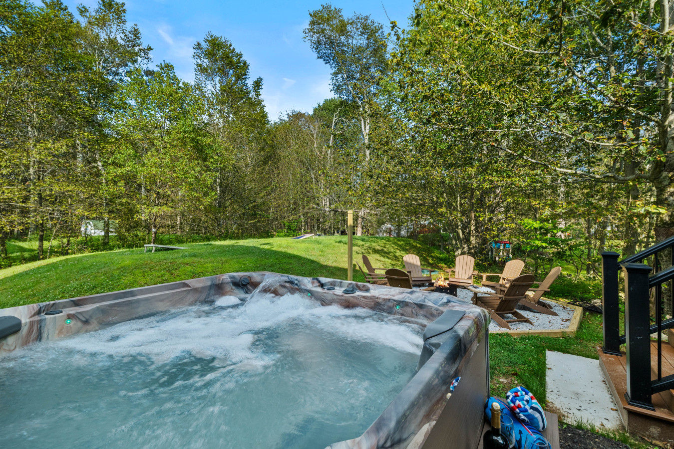 Unwind in the private hot tub — perfect for relaxing after a day of exploring the Poconos, no matter the season.