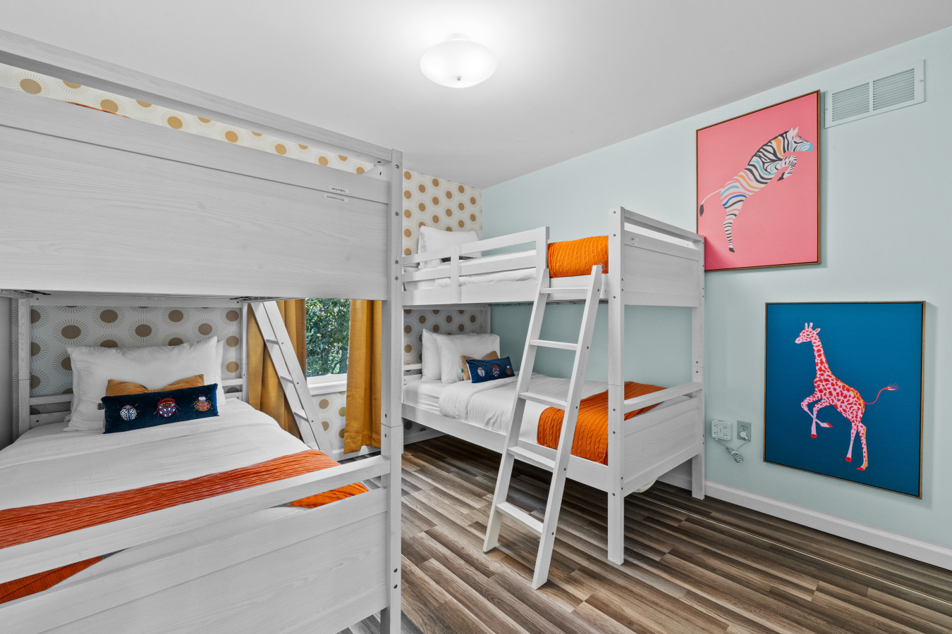 Bunk bedroom featuring 4 cozy beds to accommodate everyone comfortably.
