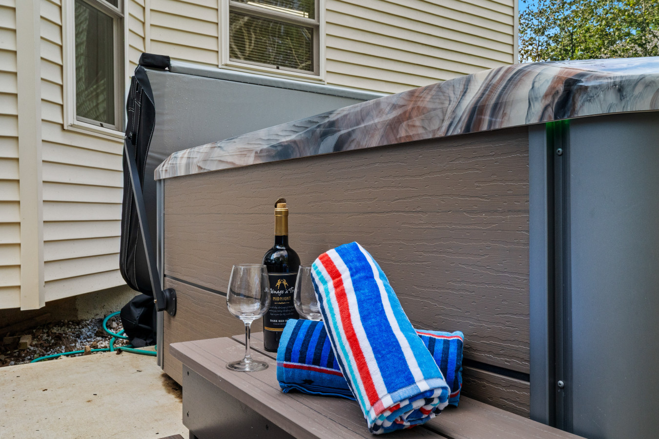 Hot tub cover keeps the water warm and clean—just a heads-up: no lotions, oils, or makeup while soaking!