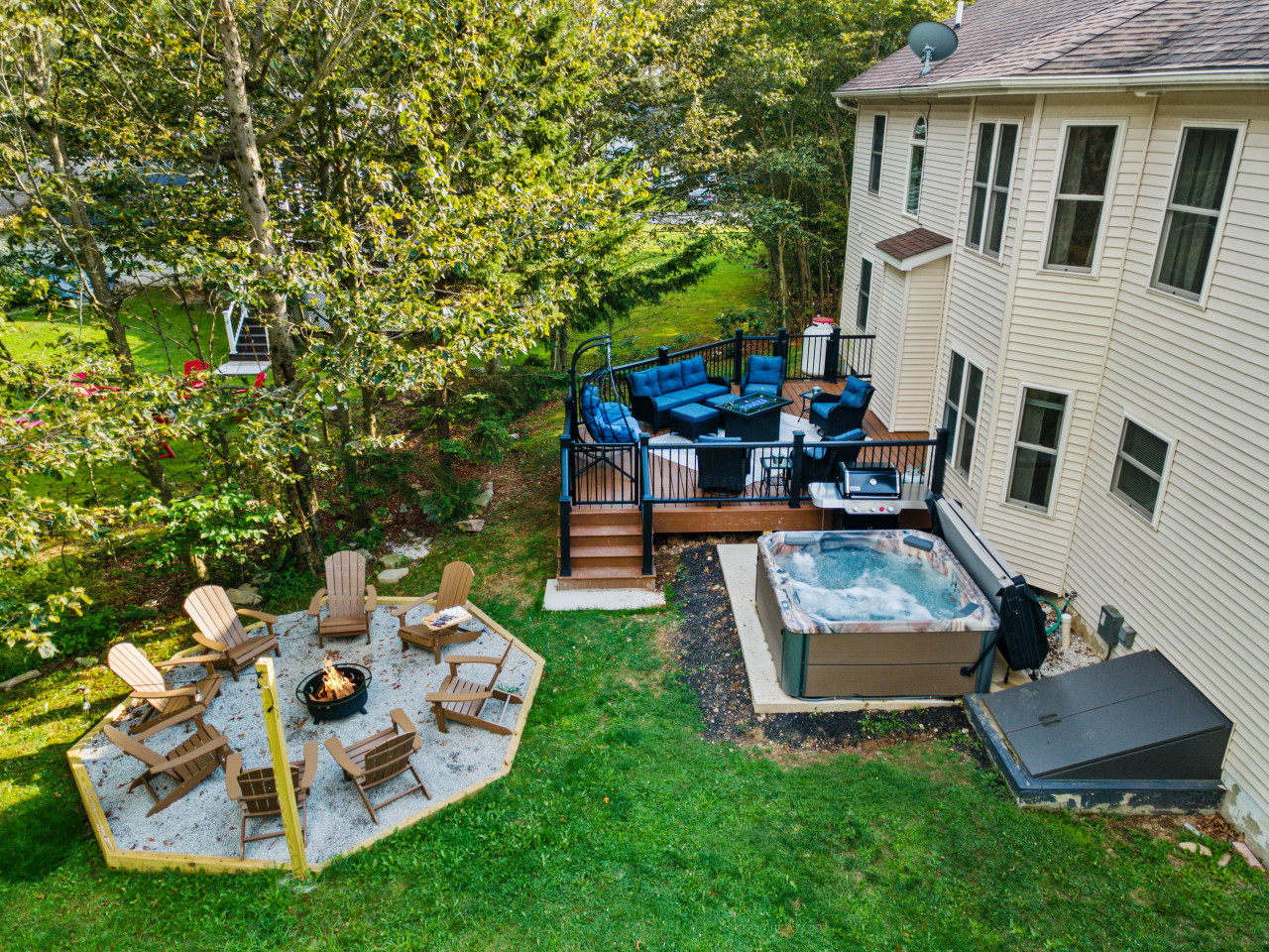 Backyard bliss at Pocno Haven! Unwind in the hot tub, gather ‘round the firewood pit or deck fire table, and kick back with plenty of cozy seating. Your perfect outdoor escape awaits.