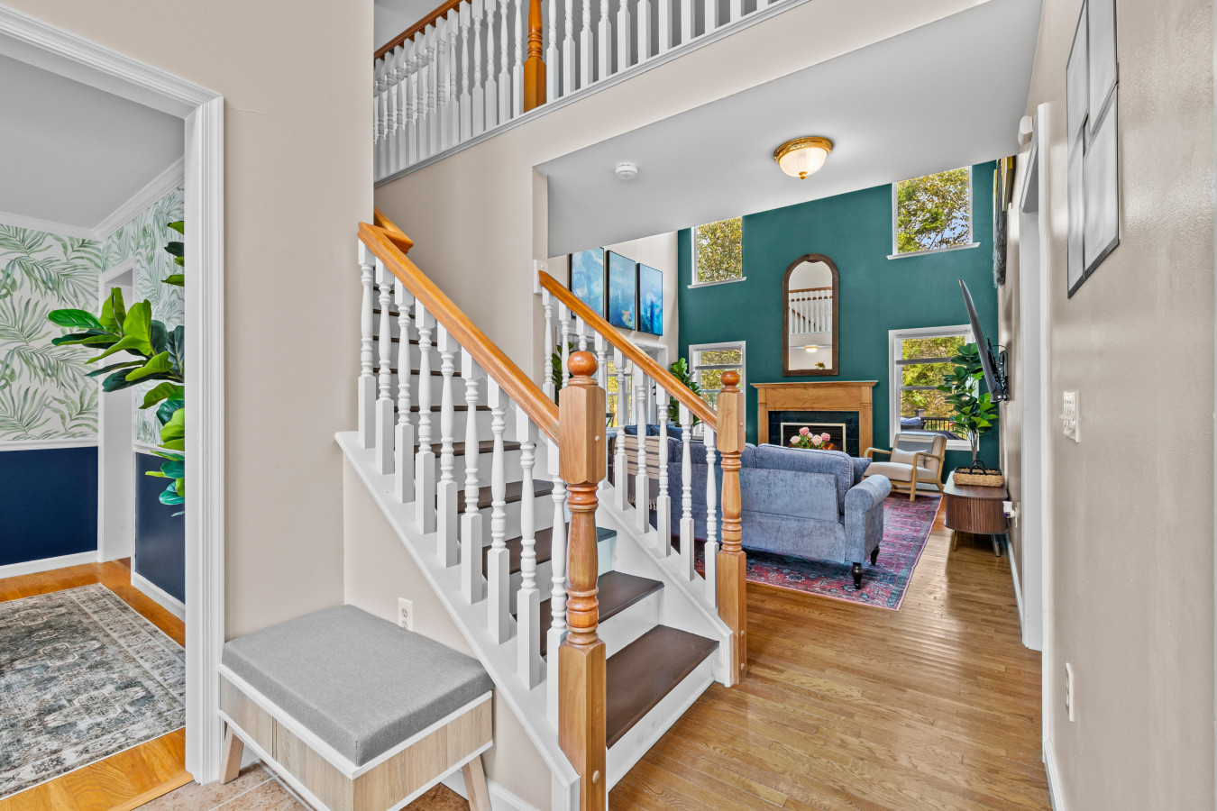 Stairs lead to the second-floor bedrooms, offering a cozy retreat above the main living space.