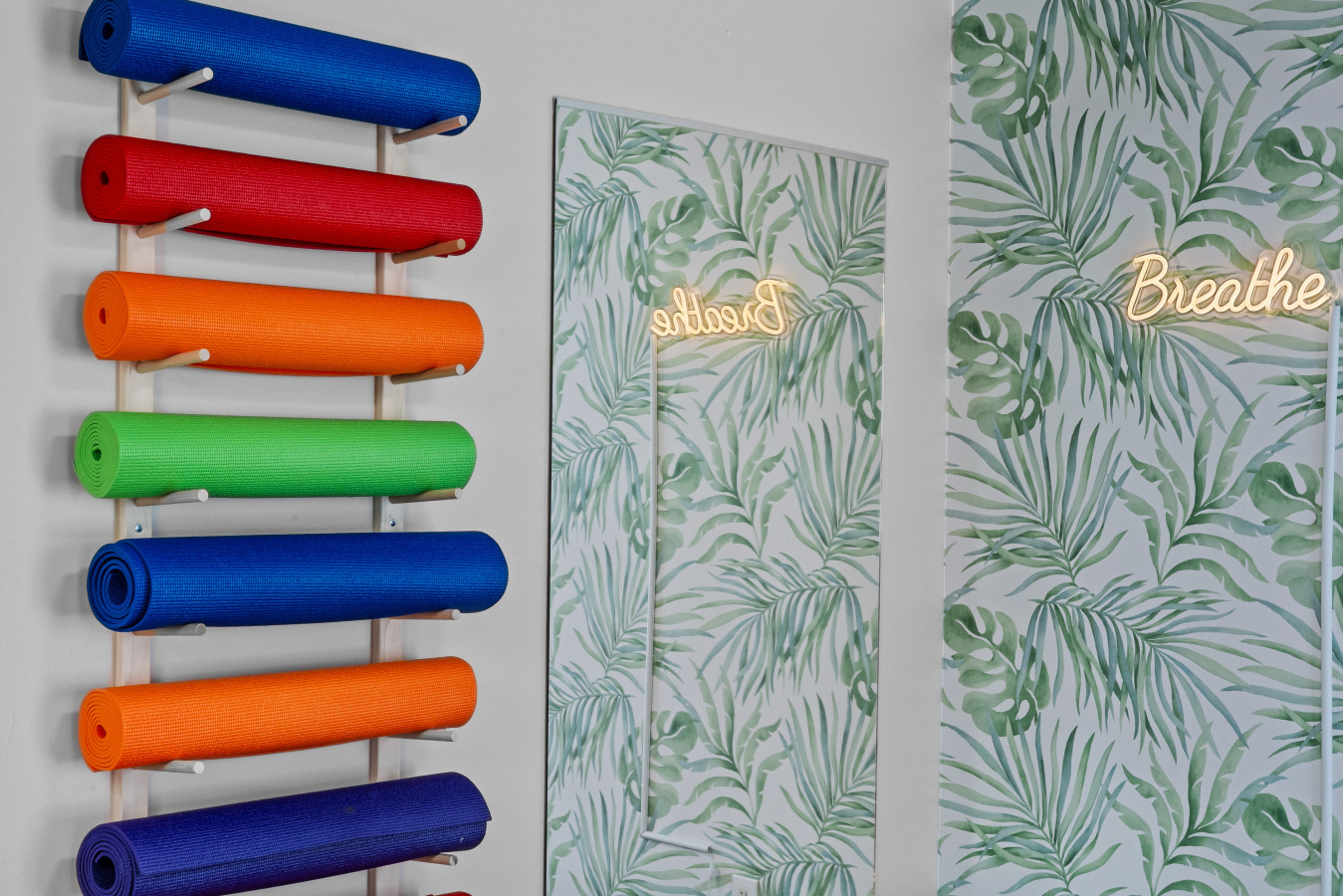 Grab a yoga mat from the wall, then relax, stretch, and flow at your own pace.