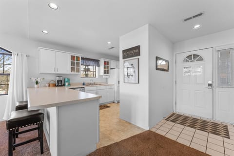 Bright and modern kitchen with ample counter space and updated appliances.