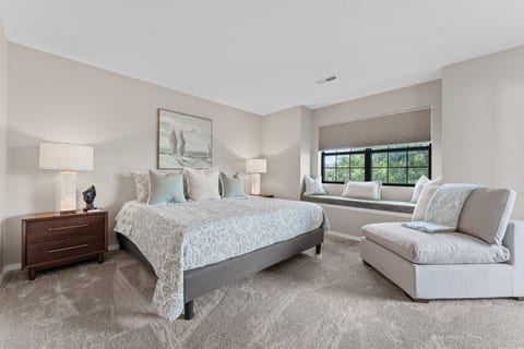 🛌 Retreat to the luxurious king primary suite with spa-inspired lighting, soft neutral tones, and seating perfect for unwinding.