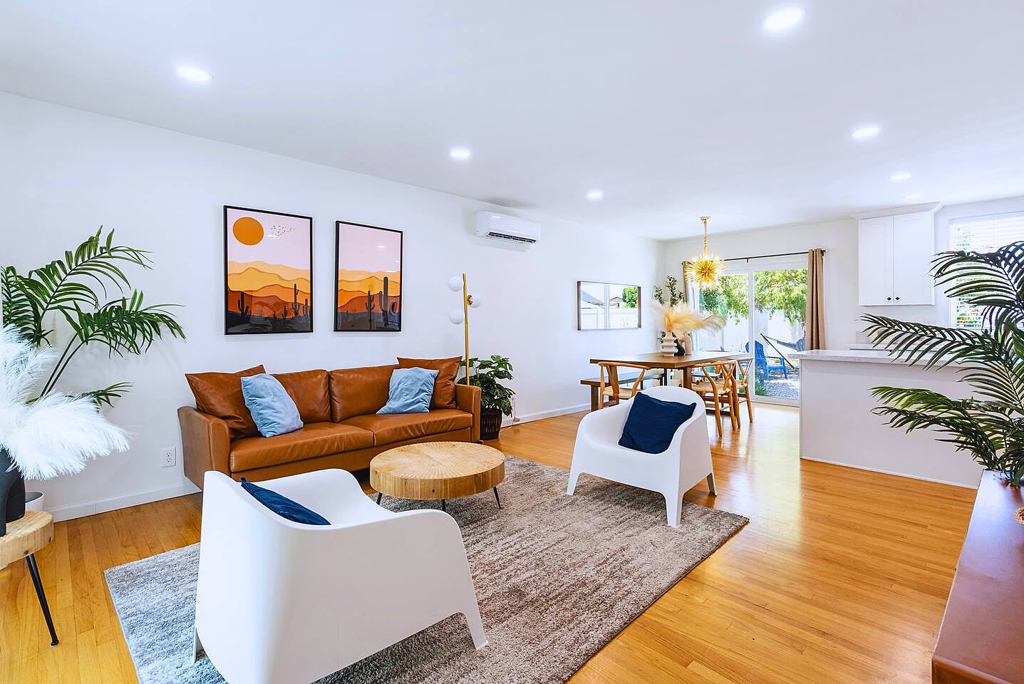 Bright, spacious living area with modern décor and comfy seating — perfect for relaxing after a day at Disneyland (just 8 mins away!). Enjoy movie nights or gather for meals at the open dining space.