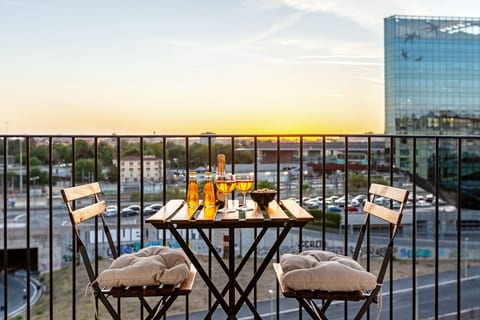 Enjoy a drink with a view from the master bedroom's balcony.