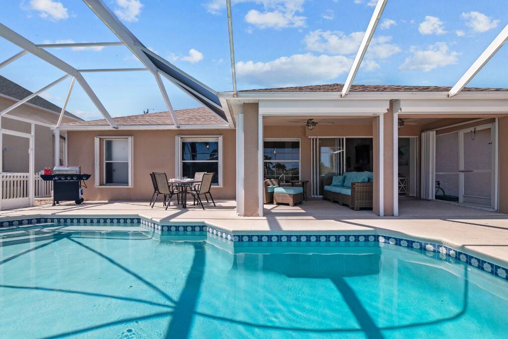 Enjoy comfortable Florida living under the screened lanai.