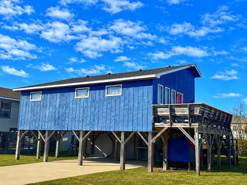 Your elevated beach escape awaits—blue skies, coastal breezes, and a spacious deck made for your morning coffee or sunset views. This raised retreat is yours to relax, recharge, and enjoy.