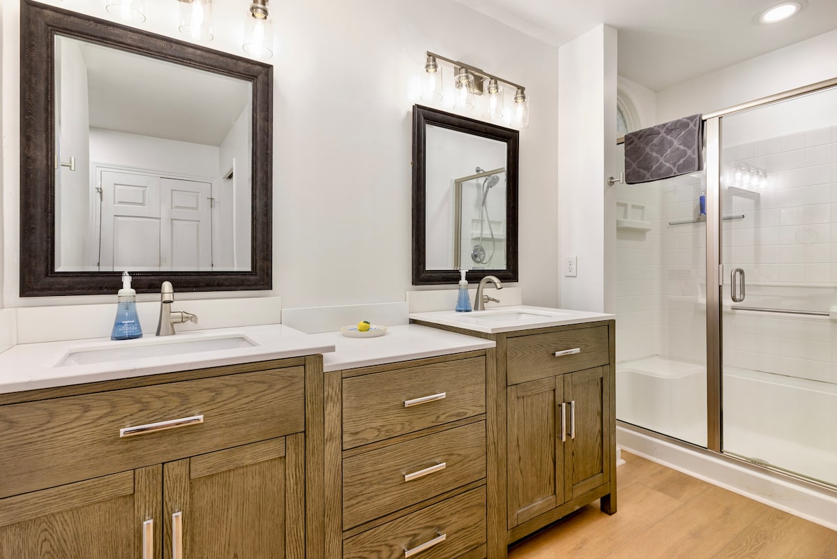 Dual vanities; Walk in Shower with removable shower head.