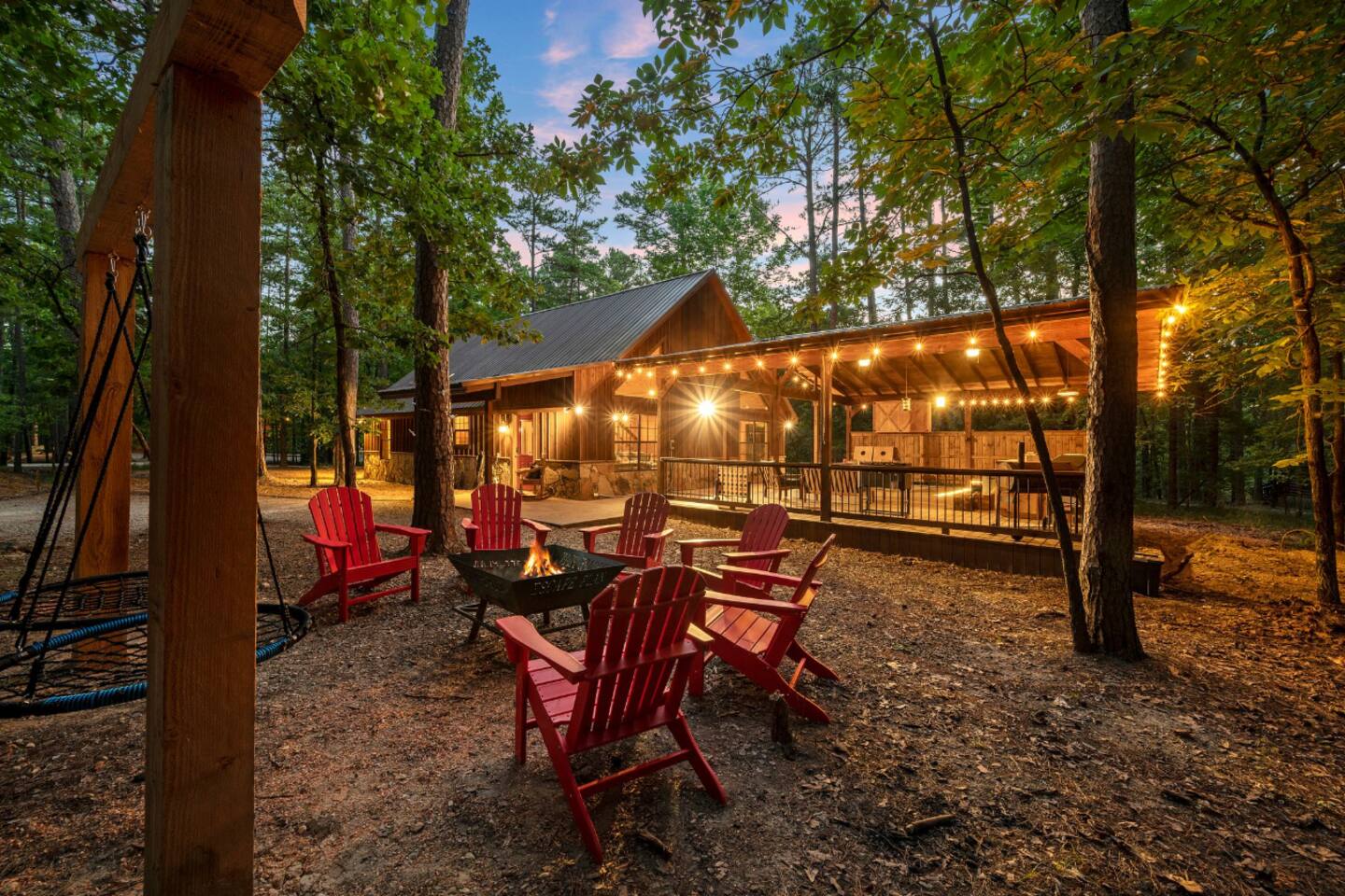 This is a picture of the back of the cabin. I consider one of the best parts of our cabin to be this outdoor space! New pictures that include mini-golf and playground will be coming soon! 