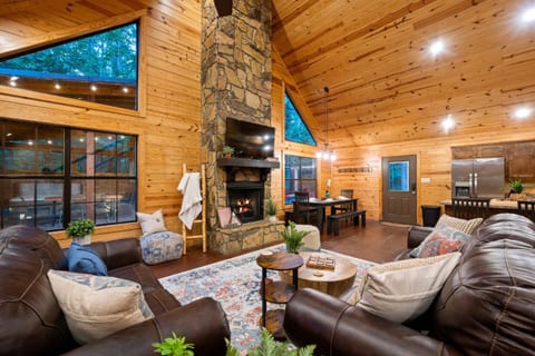 Here is the living room. It is a large open space that also includes the kitchen and dining table. 