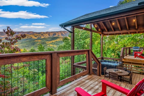3 tiered deck, 4 polywood adirondack chairs, 2 polywood rockers, new propane grill, and an outdoor dining table with chairs (also polywood)