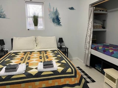 Queen Size Bed (sleeps 2) and Bunk (smaller than a twin; sleeps a child)