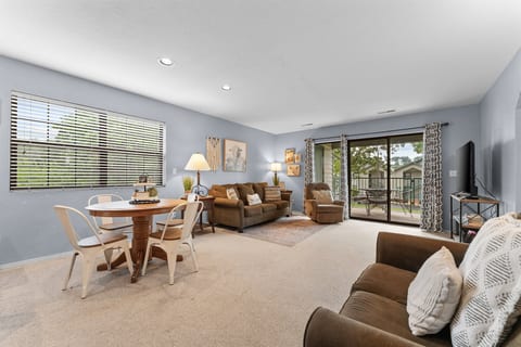Stretch out after a day in Branson with an open living area, dining space, and easy patio access.