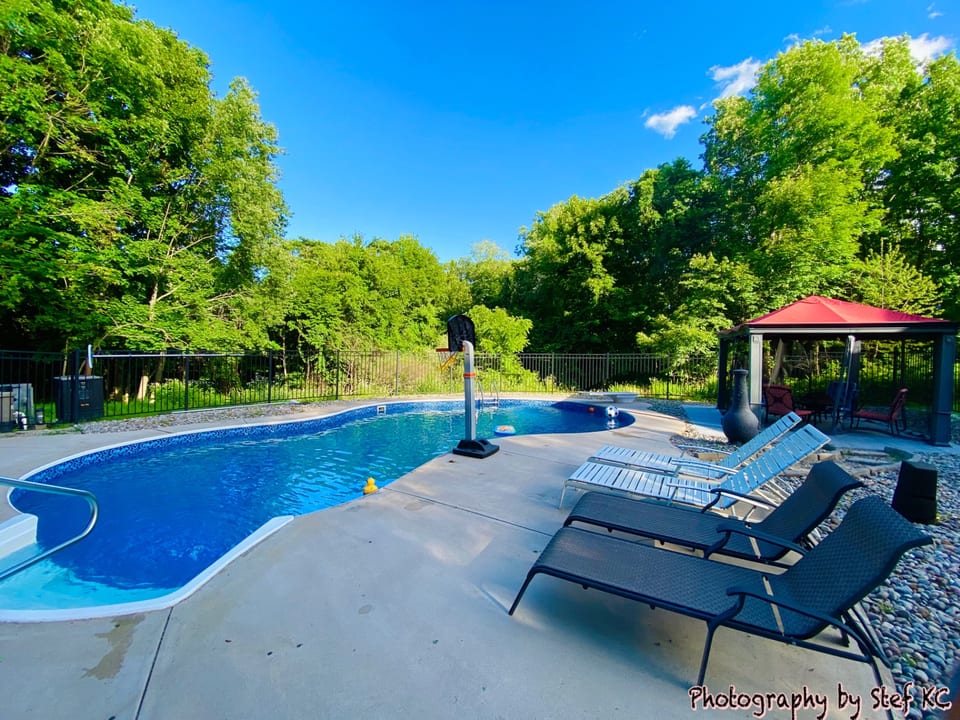 17x35 inground pool with diving board and gazebo