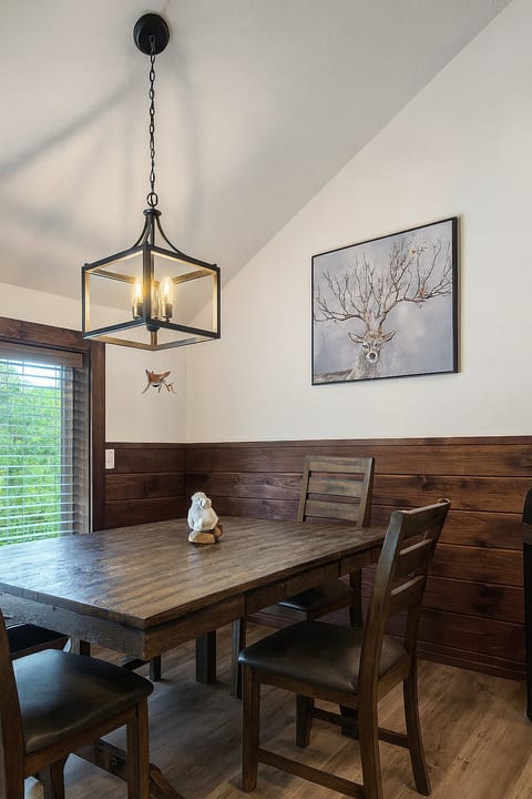 Rustic dining nook with lantern pendant and woodland charm