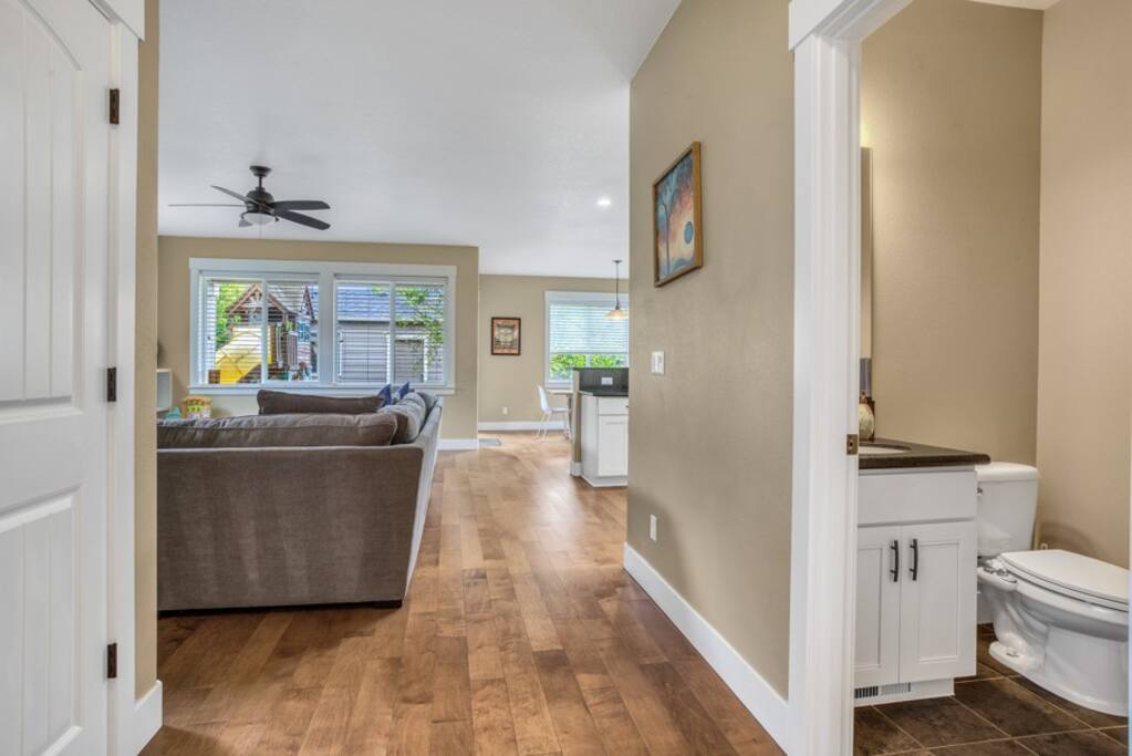View from entryway into downstairs full bathroom 