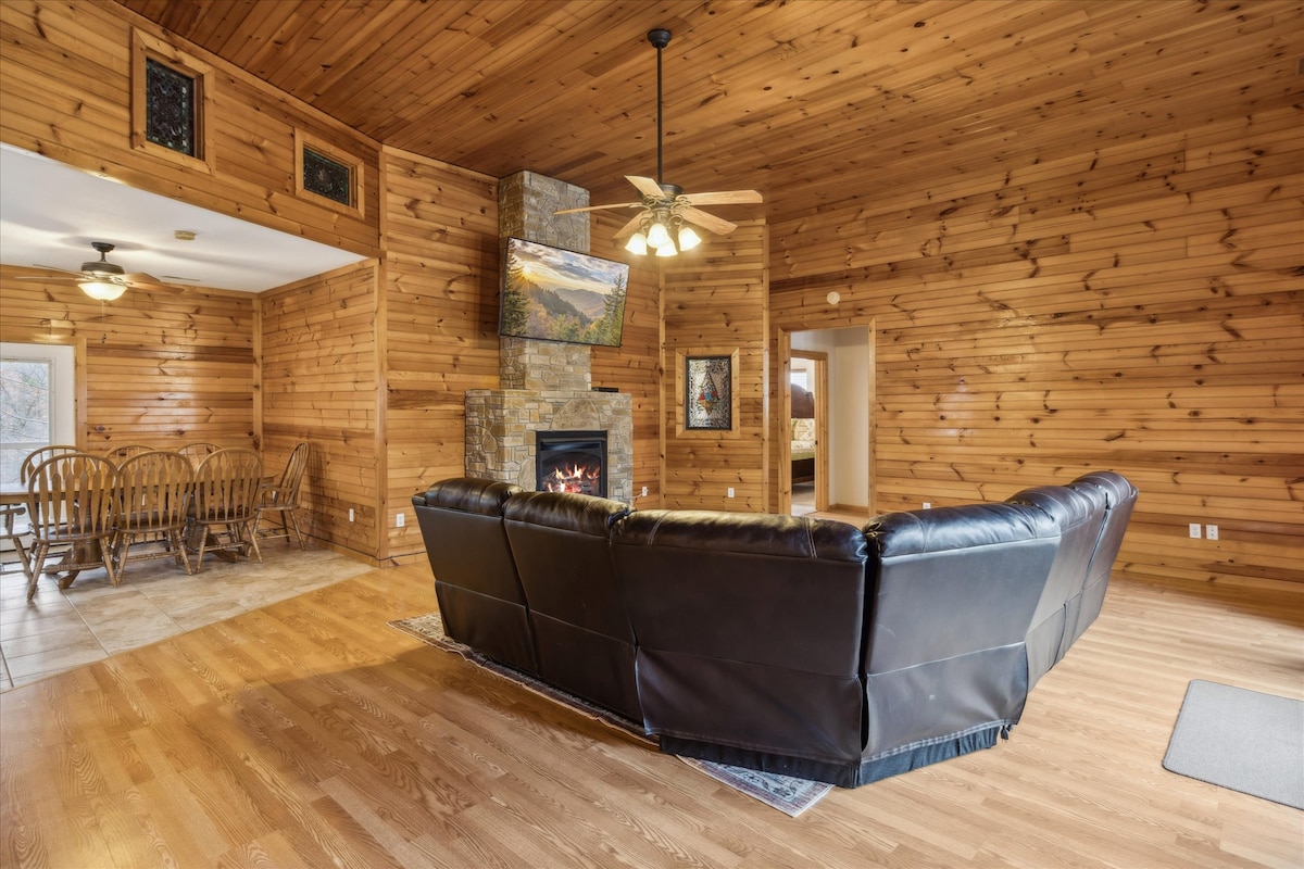 Living Room: Rustic charm meets modern comfort with a stone fireplace and inviting seating area!