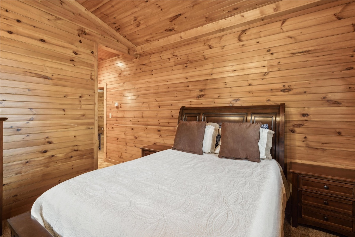 Rustic charm meets comfort with wood accents and a plush queen bed!