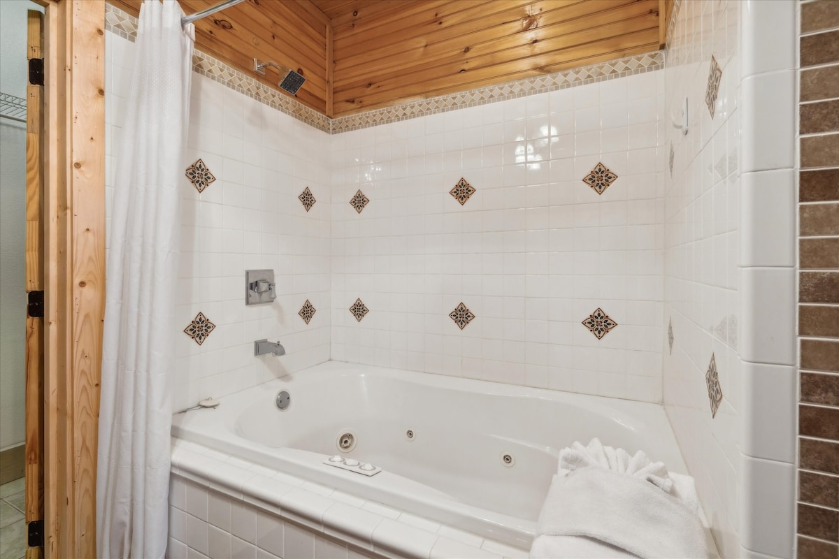 Indulge in relaxation in the primary ensuite, with a jetted tub surrounded by elegant tile accents!