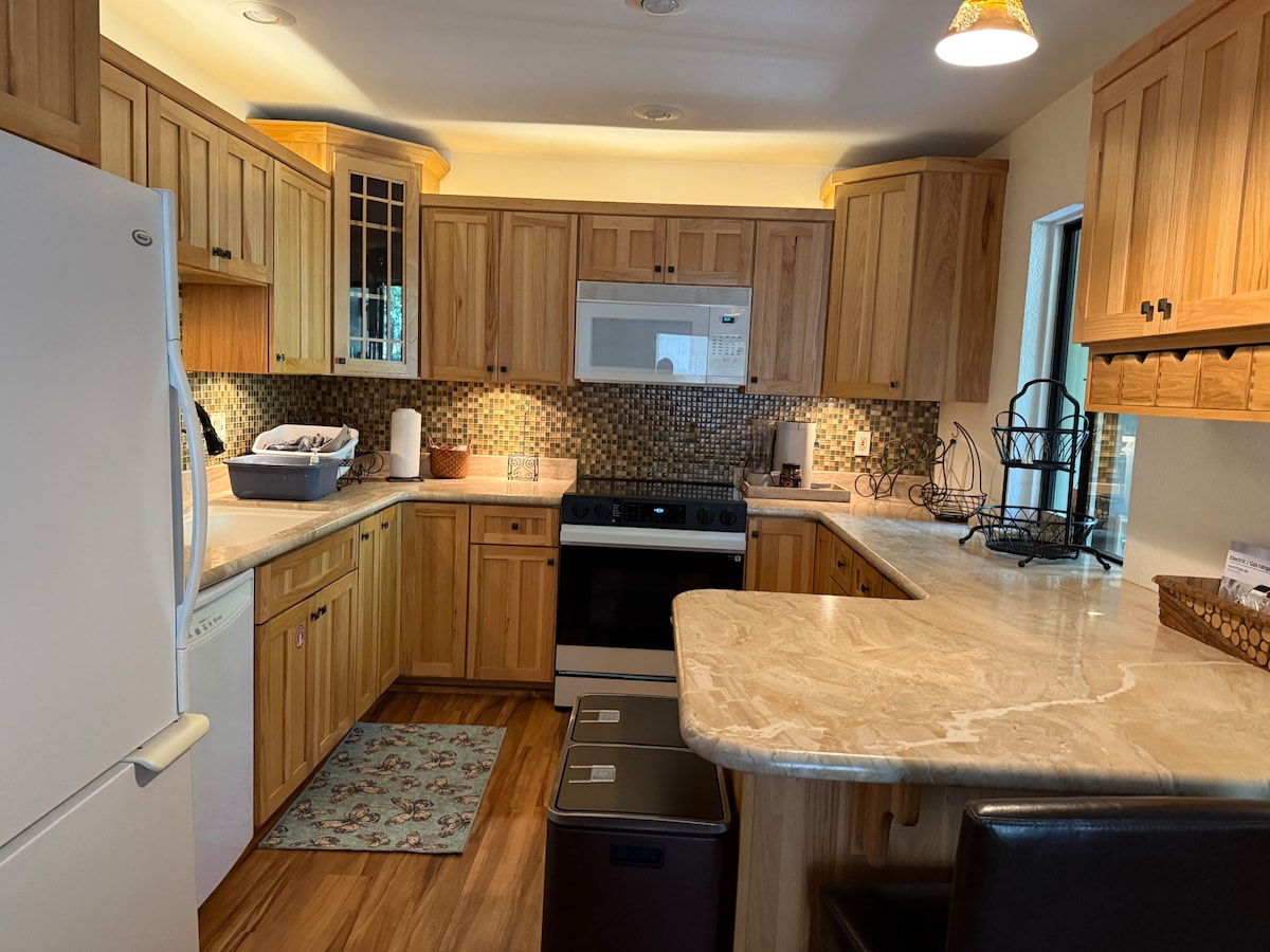 Full custom kitchen comes with marble counter tops, fridge-freezer, dish washer, electric stove range with air-frier and convection oven. 