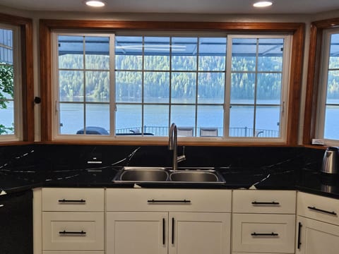Enjoy the view of the lake and deck from the kitchen.