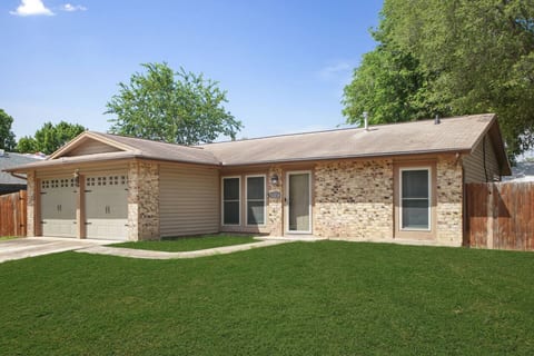 Charming single-story home with a two-car garage, warm brick exterior, and fresh curb appeal - your perfect blend of comfort and style.