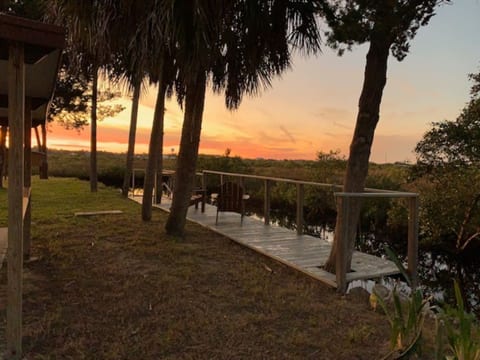 Dock and fish cleaning station, overlooking the marsh at sunset